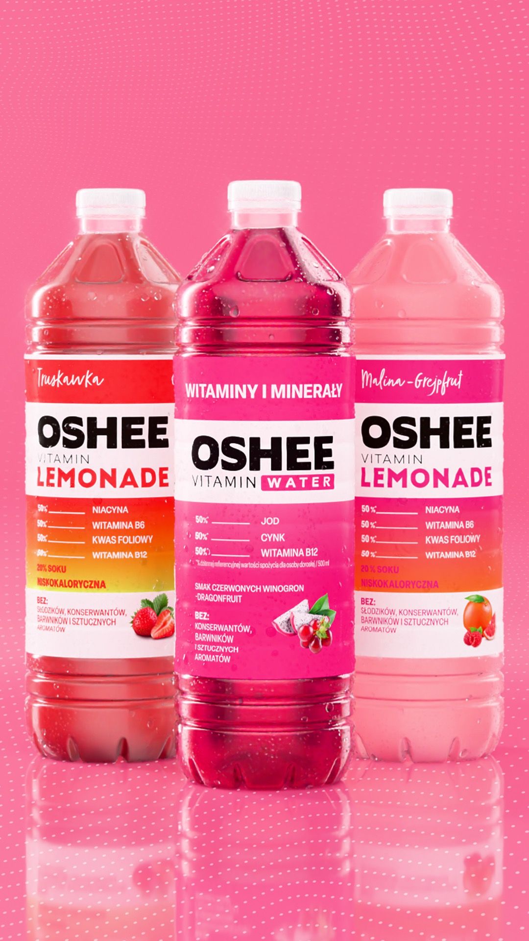 Three OSHEE bottles side by side on pink: Strawberry Vitamin Lemonade, Vitamin Water in red grape and dragon fruit, and Raspberry-Grapefruit Vitamin Lemonade, 3D CGI product render