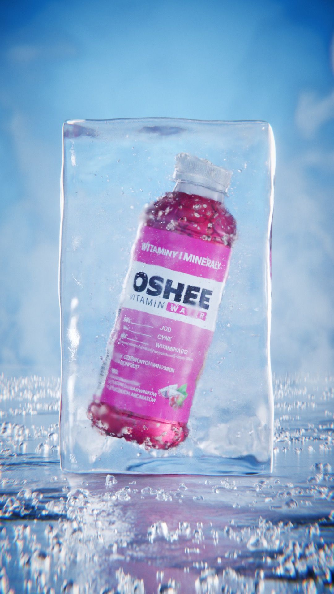 Pink OSHEE Vitamin Water bottle, red grape and dragon fruit flavour, frozen inside a clear block of ice on a wet surface under a blue sky, 3D CGI product render