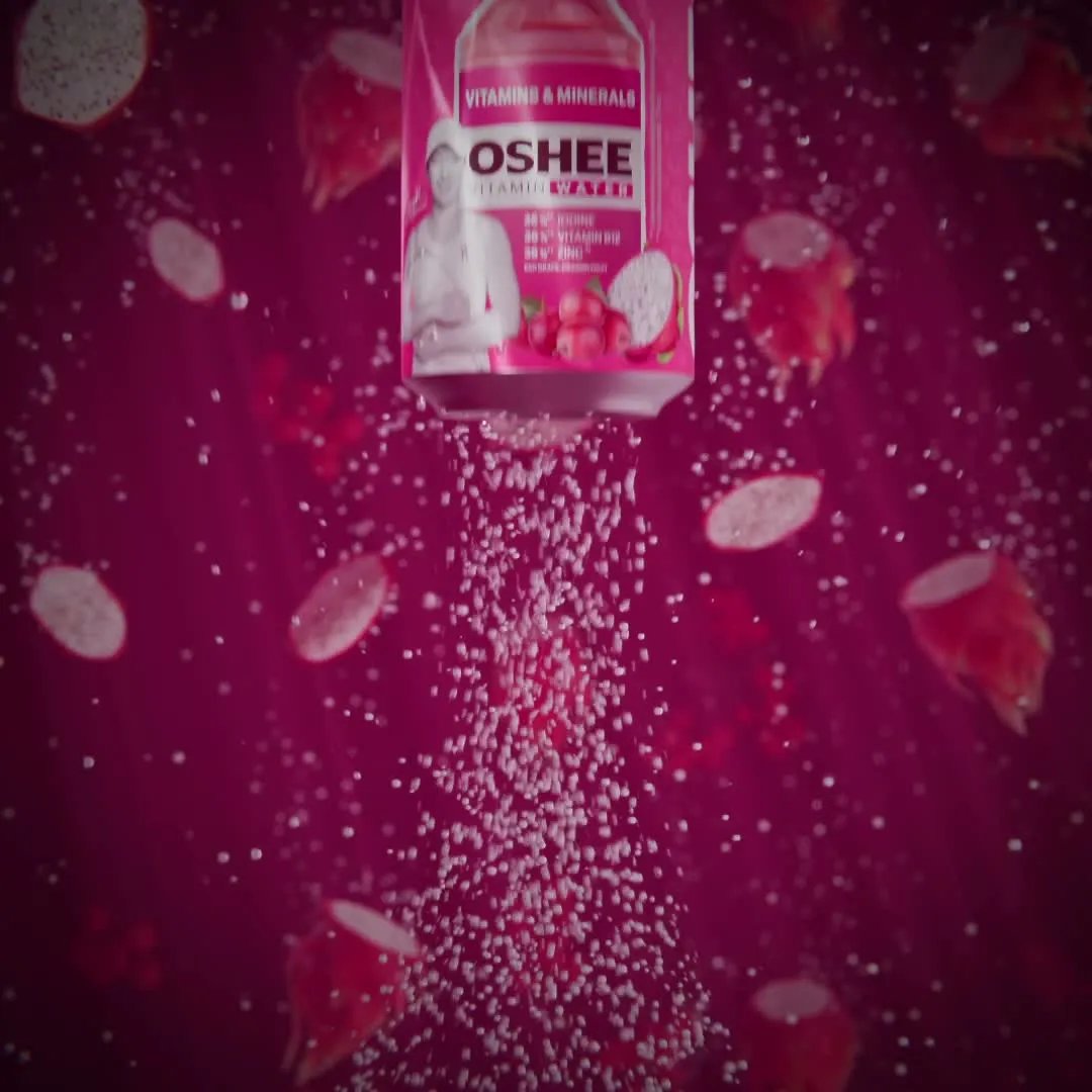 Square frame from the OSHEE Sparkling Water animation, the can amid pink carbonation bubbles